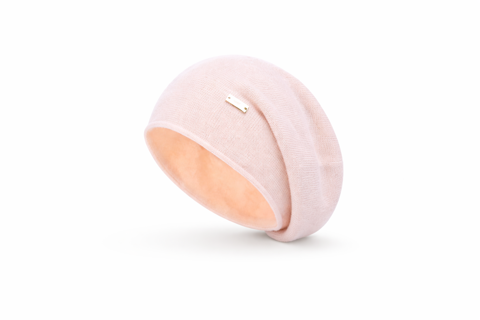Pink and peach-colored round object on a white background