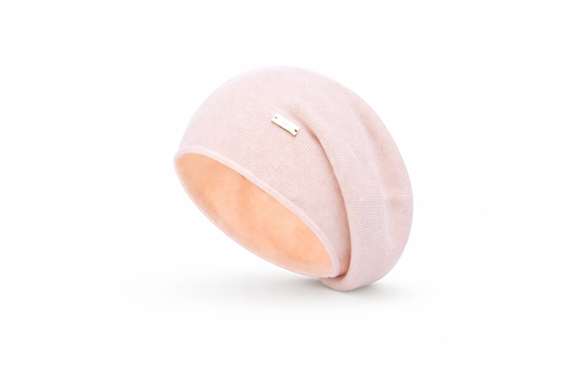 Pink and peach-colored round object on a white background
