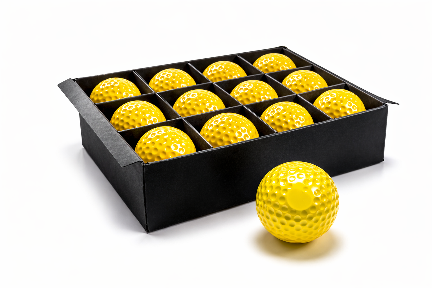 Yellow golf balls in a black box on a white background