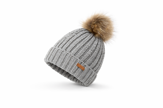 Gray knit beanie with a fur pom-pom on a white background