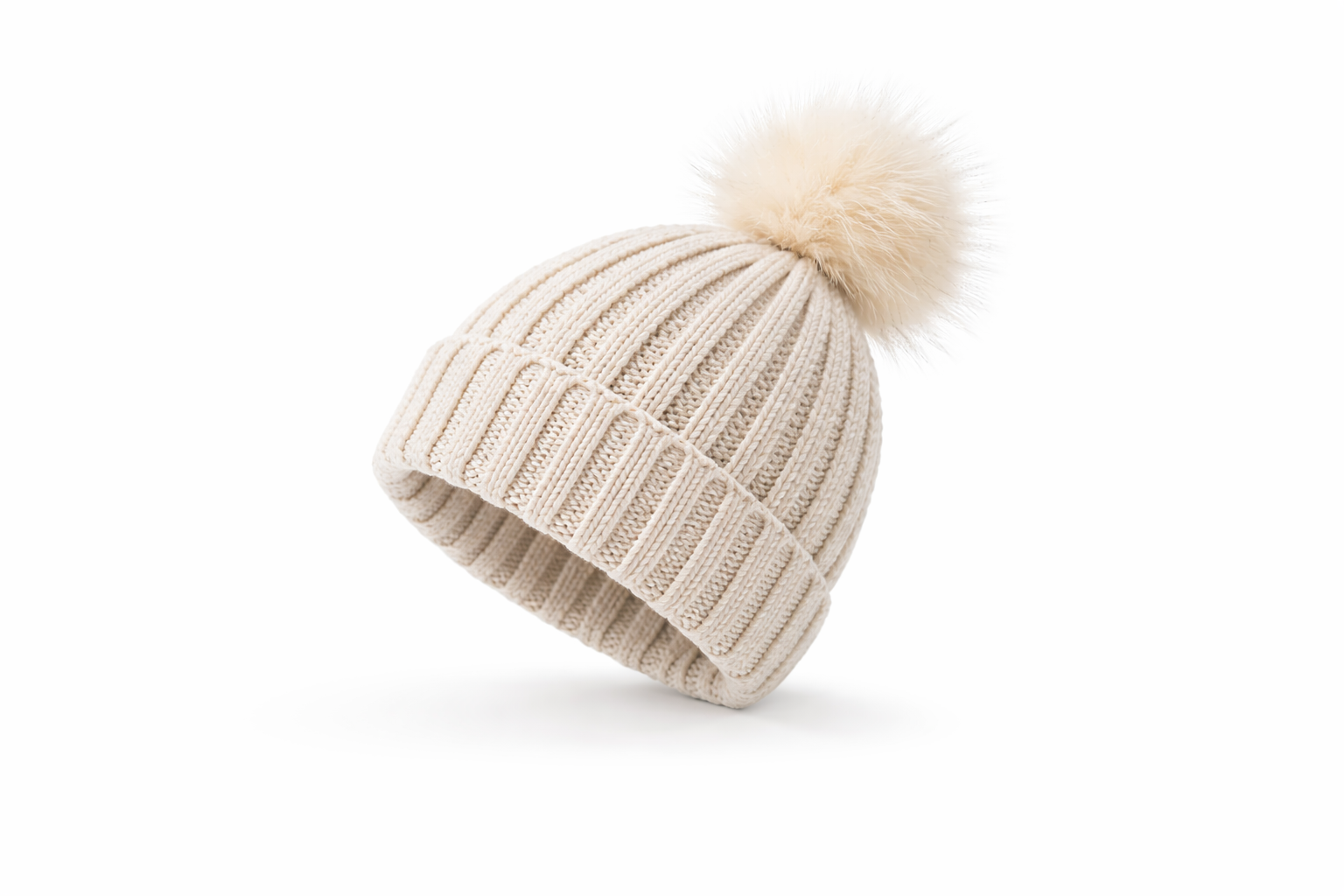 Beige knit beanie with a pom-pom on a white background